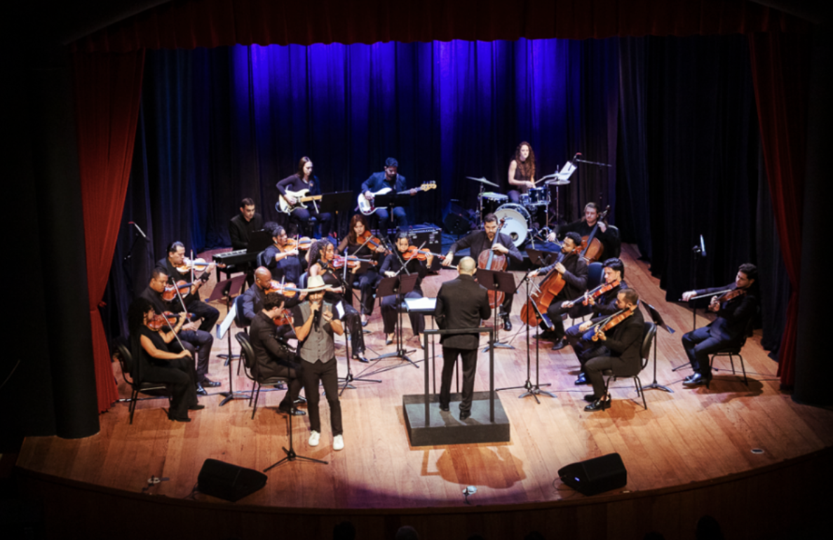 Imagem ilustrativa de uma orquestra, ilustrando os eventos culturais em comemoração aos 80 anos do SESI. As comemorações acontecerão em Brasília, nos dias 22 e 23 de agosto.